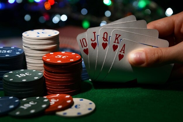 Live casino dealer at blackjack table with multiple camera angles